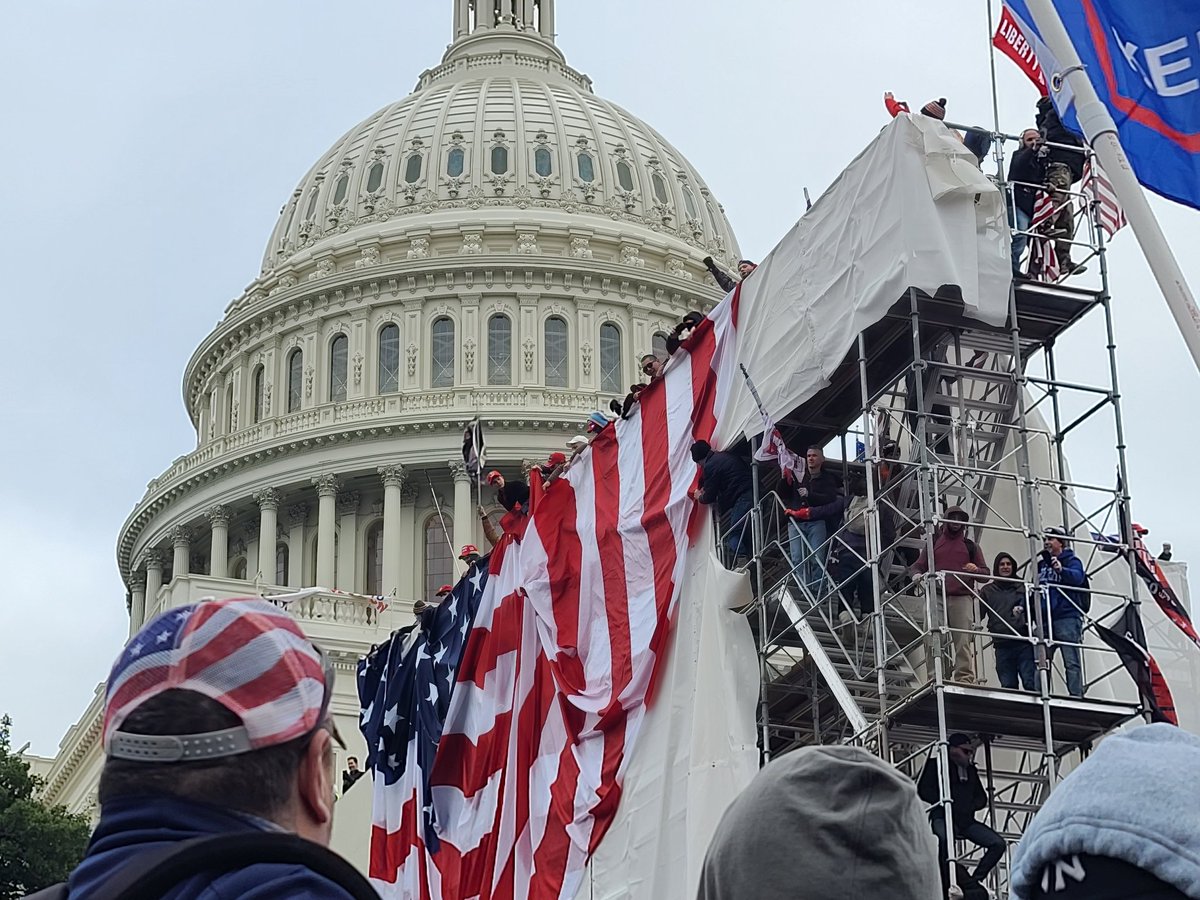 It was another surreal moment seeing folks climb the scaffolding with capitol dome in the back ground. I still can't process it all. Folks bring a giant American flag to drop from the top. 76/