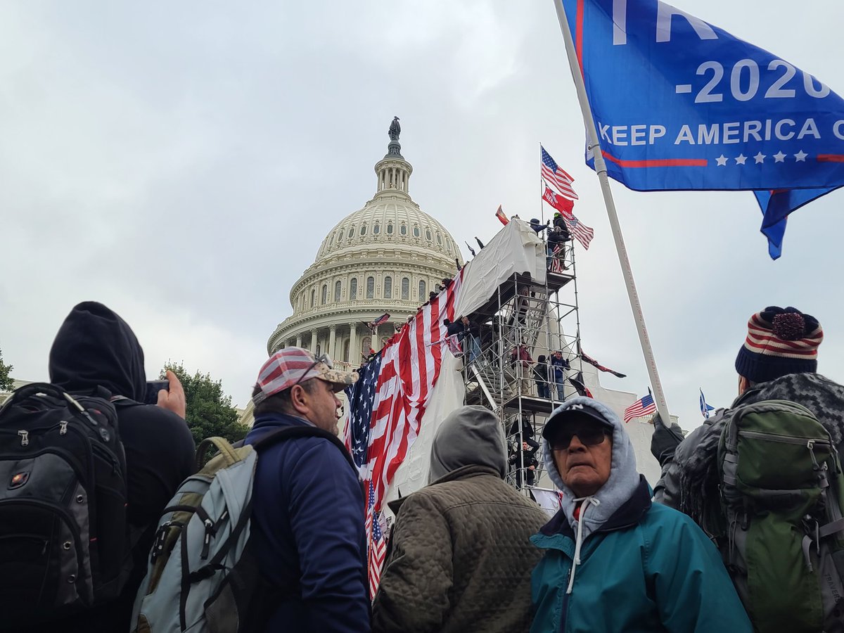 It was another surreal moment seeing folks climb the scaffolding with capitol dome in the back ground. I still can't process it all. Folks bring a giant American flag to drop from the top. 76/