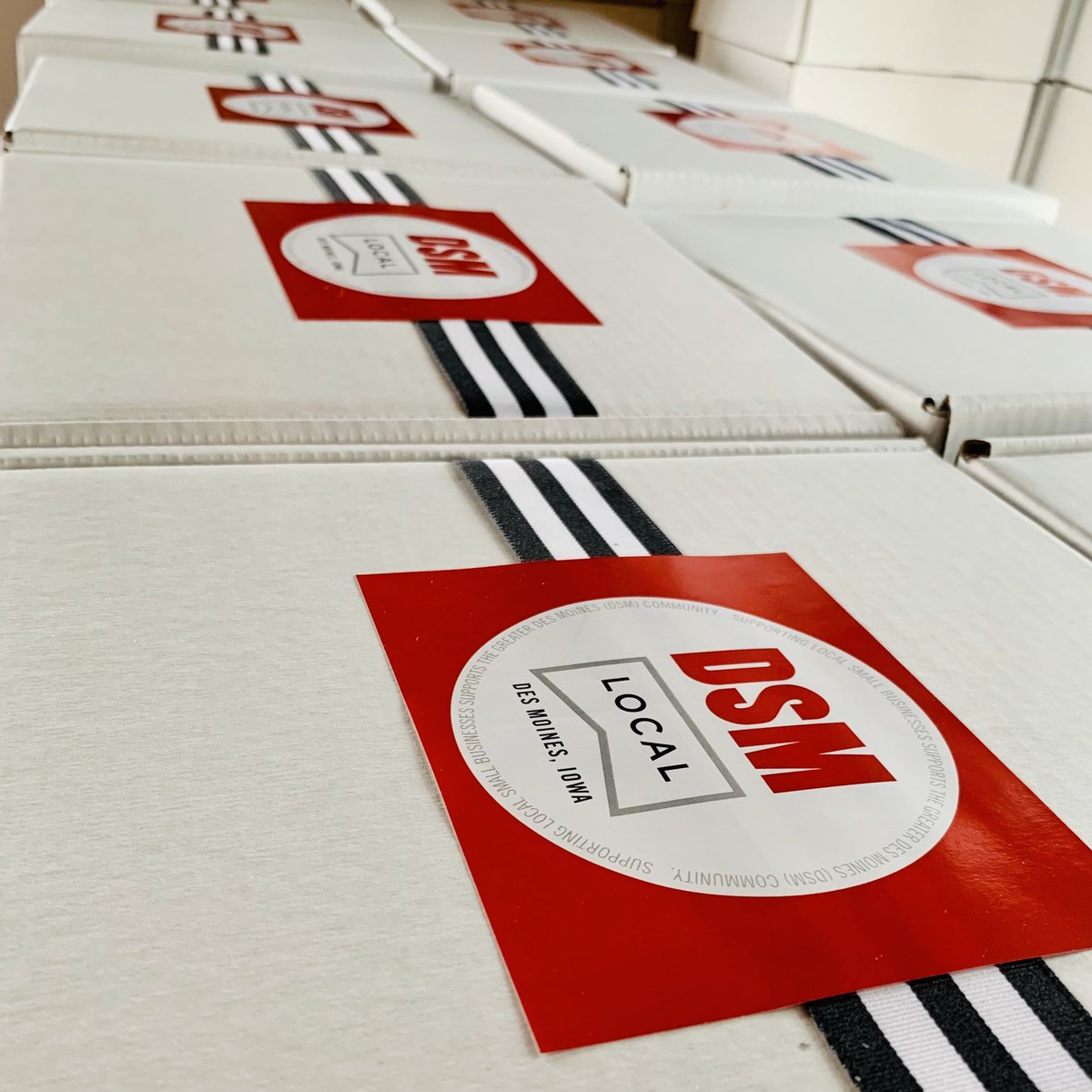 LoveDSM's tweet photo. The #DSMlocal boxes are ready for @DSMpartnership 202ONE Annual Kickoff attendees. There’s still time to register and support some #DSMUSA businesses with the purchase of a #DSMlocal box. Register for the Thursday, Jan. 14 virtual event here: https://t.co/KxnVw2JhTQ https://t.co/QWyXc1h59u