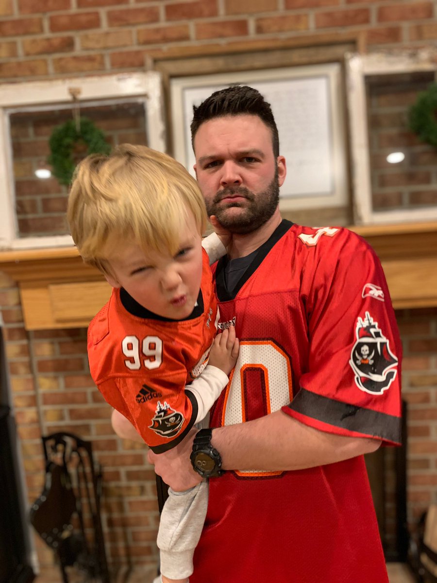 coachdharmon's tweet photo. 14 years since #TheBucs last playoff game. We’re ready for it. Throwing it back in our Alstott and Sapp jerseys. Party like it’s 2003. @Buccaneers https://t.co/0GXZOAaW0J