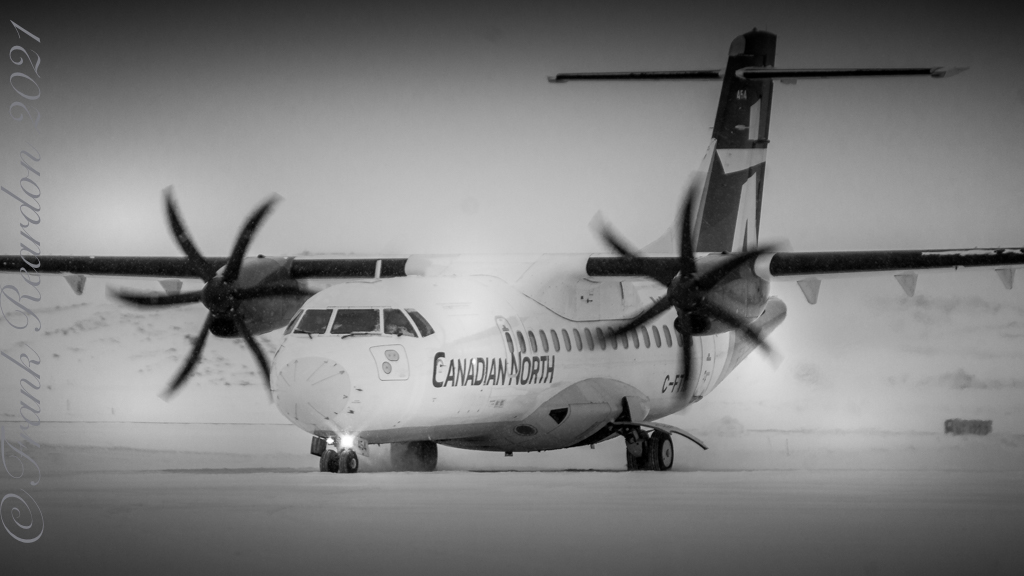FrankReardon1's tweet photo. A @ATRaircraft #ATR 42-300 #CFTIL by @CanadianNorth taxiing for De-icing in #Iqaluit #Nunavut #YFBSpotters JAN.9.2021 #Blackandwhite https://t.co/3JJI0UL3SX