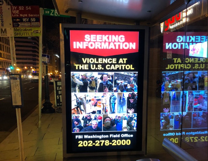 thehill's tweet photo. FBI puts up signs in DC seeking info on Capitol intruders https://t.co/OtetfUCGz6 https://t.co/GJURS7ntHC