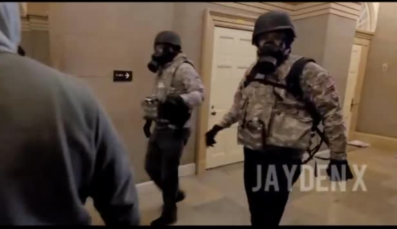 8) In terms of potential bomb planters, I'd try and ID and investigate these two guys. They seem very much on a mission. And they're wearing gas masks. (picture from 13:26)