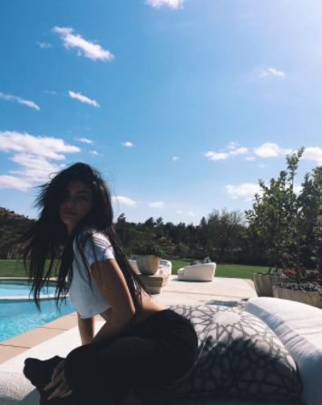 getting closer!  here kylie jenner identifies the correct part of the chair for sitting but hovers above it like it's an airport toilet seat. she has come so far 