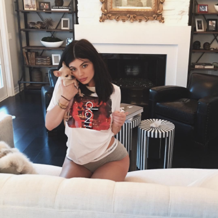 in a devastating setback, kylie jenner mistakes a chair for a confession bench and kneels. she presses her dog to her ear hoping he may whisper some tips but he remains silent 