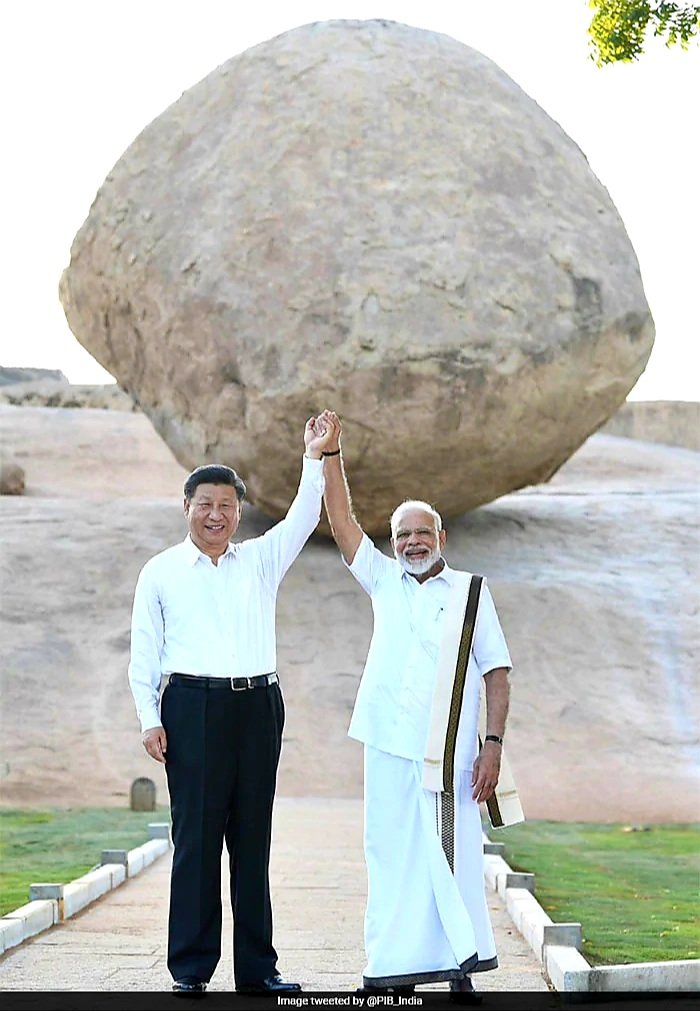 Indian Prime Minister Narendra Modi and Chinese President Xi Jinping took a photo in front of Krishna's Butterball holding hands during their second "informal summit.If this isn't a wonder what it is?