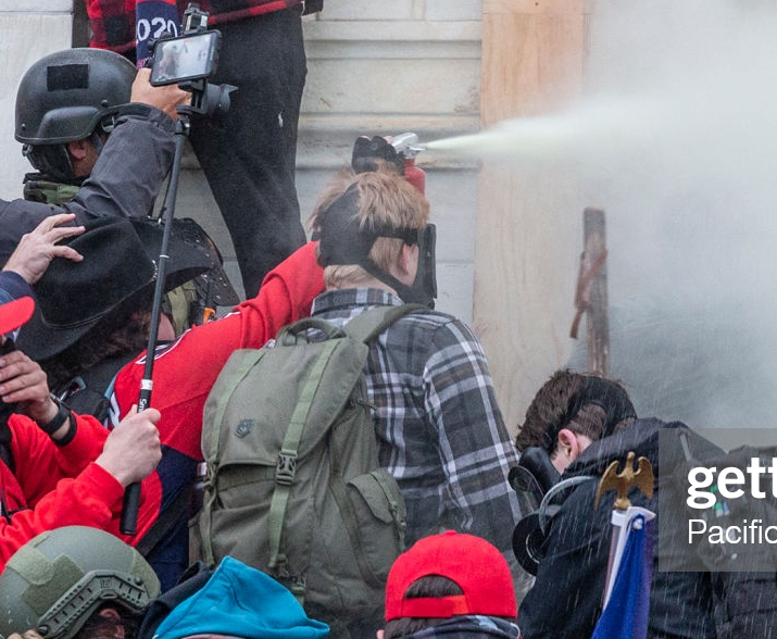 Outside Fire Extinguisher guy also has a prominent Black Hat, which is now his name. We definitely want more photos and video of him -- not sure where that spraying fits into the timeline.