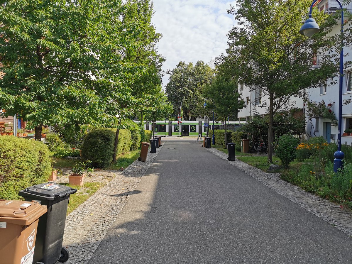 This allows for more efficient parking layouts (see  #MarmaladeLane by  @WeTweetTOWN) and encourages car clubs and electric charging.Here's a photo from a trip I took to Vauban in Freiburg where peripheral parking leads to people friendly streets