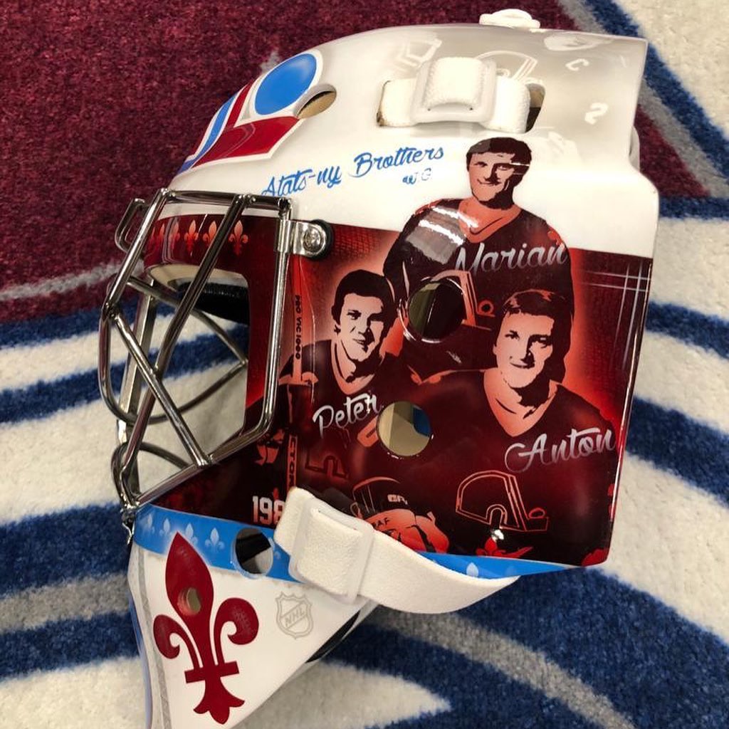 GoalieGearNerd's tweet photo. Pavel Francouz’s Reverse Retro @Avalanche mask (painted by @Koraldesign) pays tribute to legendary players of both the Avs (Sakic and Forsberg) and the Nordiques (the Statsny brothers). Note the fleur-de-lis detailing as well as jersey stripe through the center. https://t.co/GJ0YMNPe59