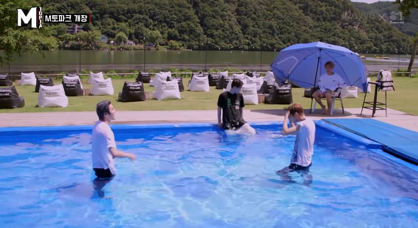The one where Ten is watching Taeyong play in the pool