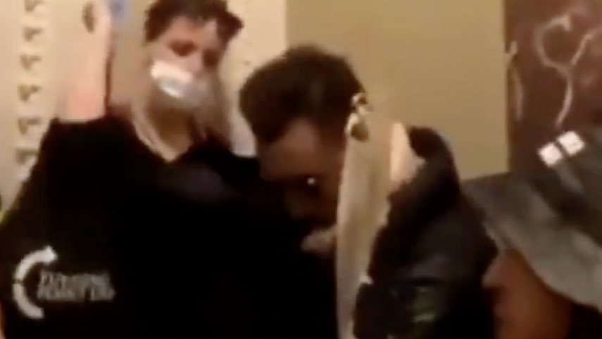 inminivanhell's tweet photo. The bag Dr. Simone Gold is carrying has a @TPUSA logo. Dr Gold has had extensive connections w/ @charliekirk11 ‘s from rallies, events, to being a guest on his show. Charlie has admitted to busing in ppl to DC and was holding a live YouTube viewing of the Capitol insurrection. https://t.co/eGJk0rgOoJ