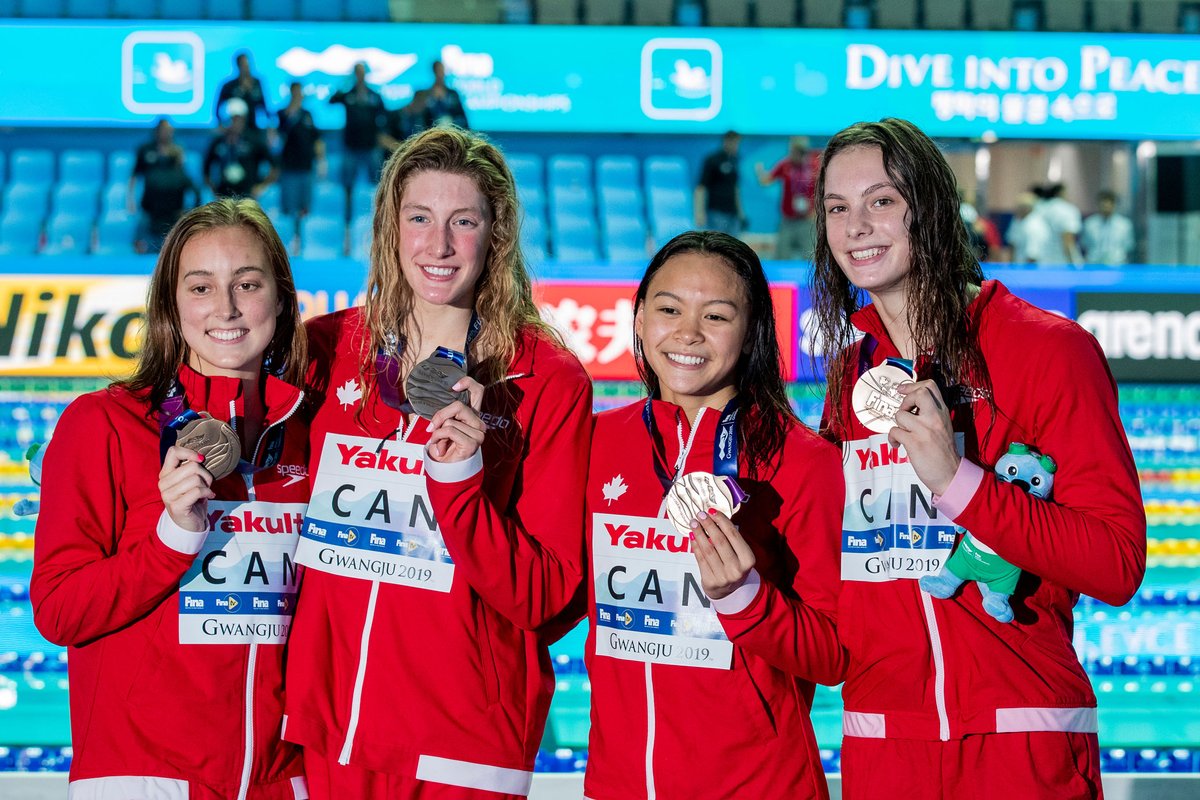 Emily Overholt, Taylor Ruck, Kayla Sanchez, and Penny Oleksiak show off their bronze medals from the women’s 4x200m freestyle relay on Thursday July 25, 2019 at the FINA World Championships in Gwangju, South Korea. (Joseph Kleindl/Swimming Canada)