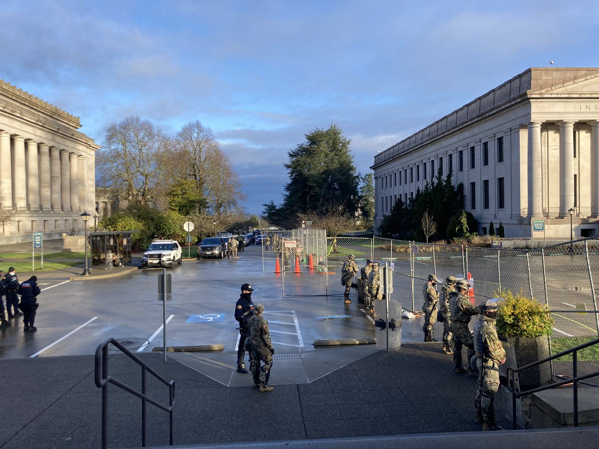 AustinJ_Reports's tweet photo. The scene at the WA Capitol this morning. National Guard members in place and a perimeter fence. This is in advance of the opening day of the #waleg  legislative session tomorrow. https://t.co/0cUtHkciyy