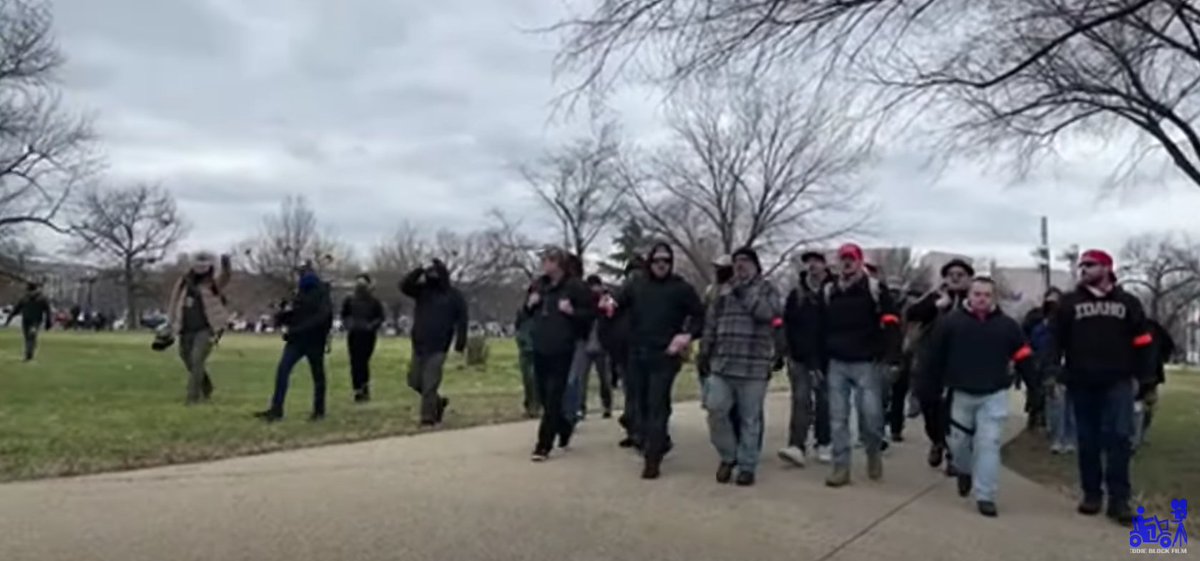 Orange appears to have been a big theme around the Proud Boys Jan 6. As the group advances on the capitol, three guys with orange armbands walk next to Nordean and Biggs — two top PB leaders nationally — as the livestreamer says "Here come the Proud Boys."