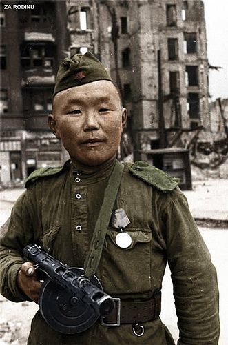 (Colorized). Red Army soldier in Berlin, either Mongolian or of one of the Central Asian Republics. Picture by Yevgeny Khaldei.