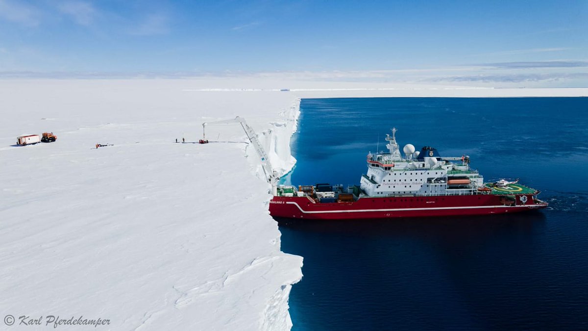 AntarcticReport's tweet image. A view of the offloading from South African research ship Agulhas II on to the Fimbul Ice Shelf; personnel are lifted from the ship via a rope basket. The supplies will be towed 160km inland to SANAE IV station; pic Karl Pferdekamper