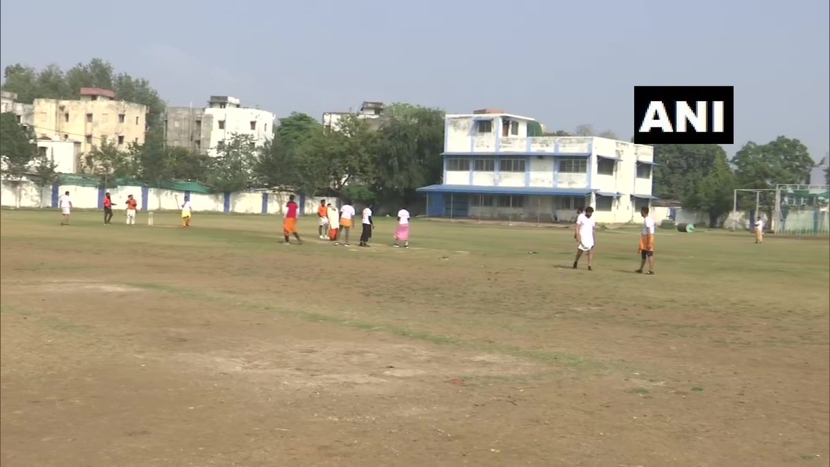 ANI's tweet photo. Madhya Pradesh: During a cricket match organised by Maharishi Vedic Parivar, all players wore dhoti and mundu and the commentary was done in Sanskrit language in Bhopal yesterday. https://t.co/VmXYrvpGtQ