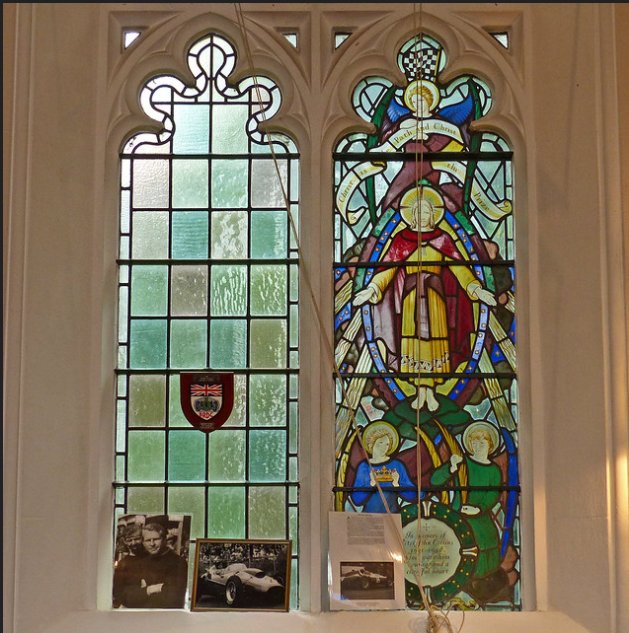 Later nave glass of around 1960, by Francis Skeat, takes on a varied character - an attractive re-setting of ex-situ medieval and C17th fragments and a memorial to Peter Collins, racing driver & local lad, who died in an accident at an event in 1958. Note the chequer flag.