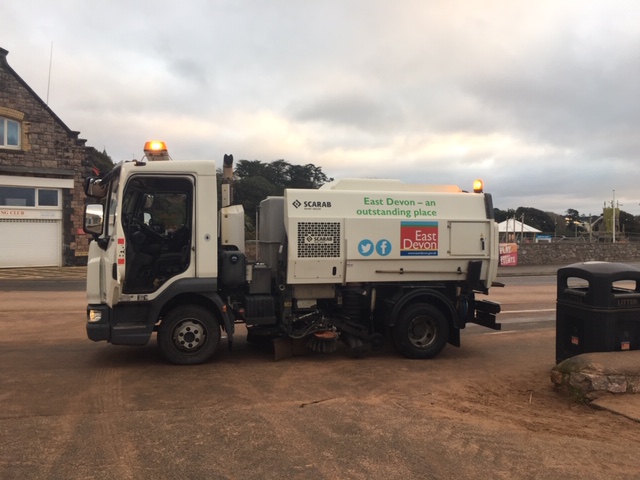 eastdevon's tweet photo. #EDDCStreetSceneOps are working hard on removing sand from the road and pavements along #Exmouth Seafront including Beach Gardens and #QueensDrive. Our teams are also working on our #beachpullback to reduce the height of the sand at the sea wall. https://t.co/OPocXRV0Xs