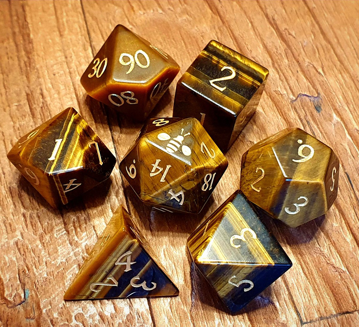 Nat1Fun's tweet photo. Bumble Bee tigers eye dice. @CrystalMaggie2 has some incredible sets and this one just fits my screen names so well. 

#dnd #twitch #livestream #gemstone #nat1fun #dice #dicegoblin #homebrew #dungeonsanddragons #community #bmblebee #dicedragon #ttrpg #tabletop #gaming #dndmemes https://t.co/kcNJEBCF8y