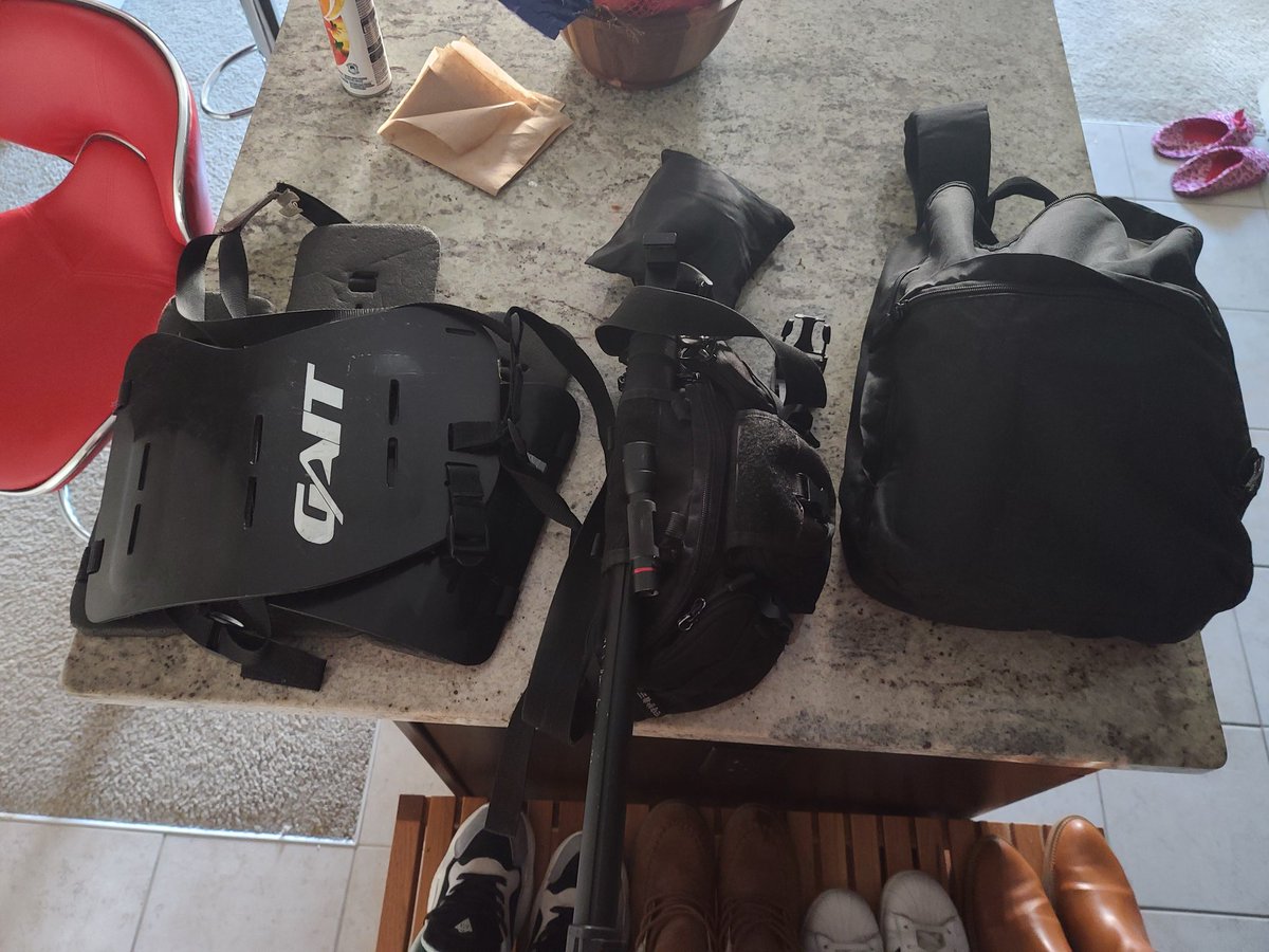 When all packed up. It is really minimalistic. My backpack contains mask and helmet, rain cover clips on to a bag, and kidneys worn. I sling black tactocle fanny pack across back and roll. Mono pod through the loop and it shifts to where comfortable. 12/