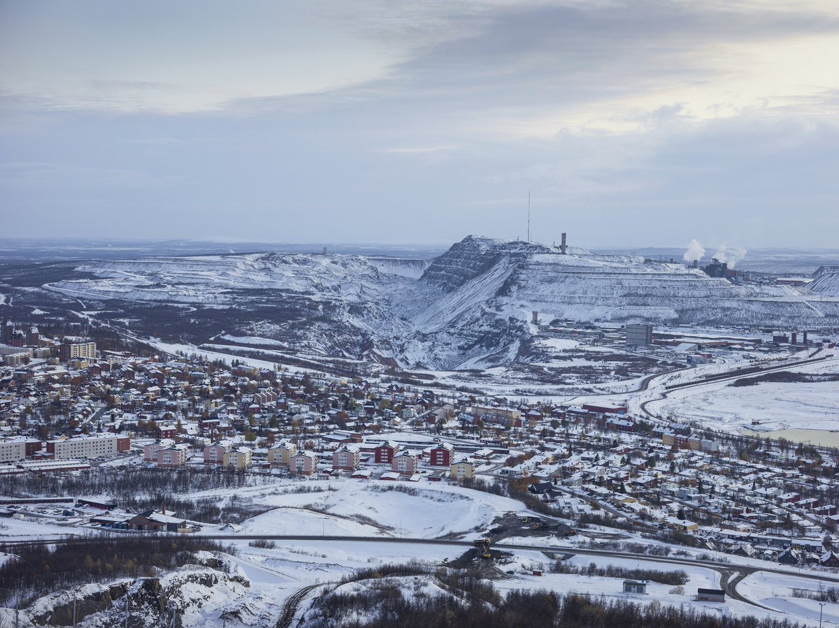 thymann's tweet image. View of Kiruna, world's largest iron ore mine. The whole town is being moved as the mine has made the ground unstable