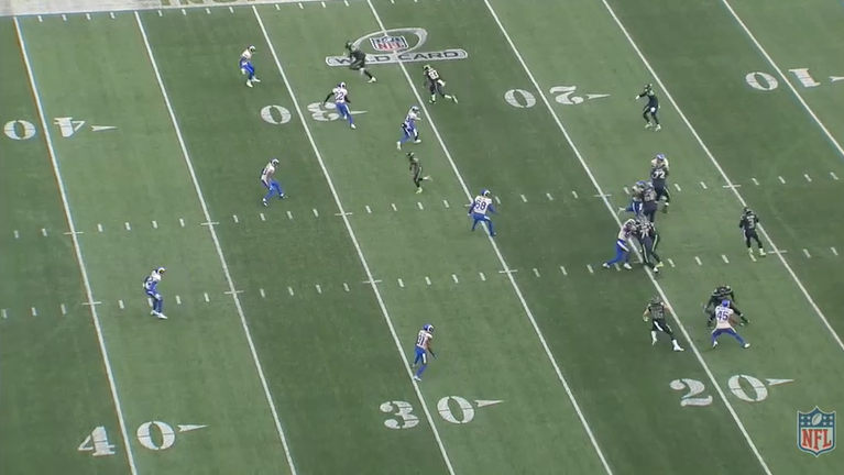 Play progressing:58 setting up shop in an interesting location in the middle of the field as Lockett and Metcalf close the distance on the DBs covering them. Hollister has released his block and entered the pattern.