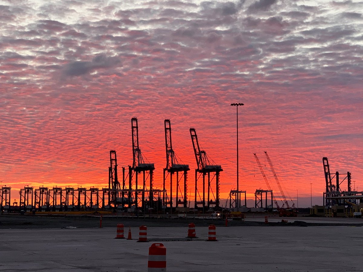 Stunning sunrise from #SCPorts Hugh Leatherman Terminal. 3 of the 5 ship-to-shore cranes have been raised and 19 RTGs are in the container yard. We will soon welcome the last 6 RTGs for Phase One. Photo: Butch Weber/ SC Ports #TomorrowIsHere #HLT
