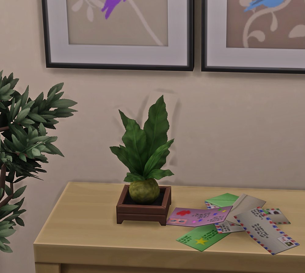 SimsMomChelle's tweet photo. @SimGuruNick Is the team aware of the graphic issue with the Kokedama Plant from Snowy Escape? It looks like really bad CC. #TheSims4 @TheSims #BugReport #SnowyEscape https://t.co/SyHL3xbFKl