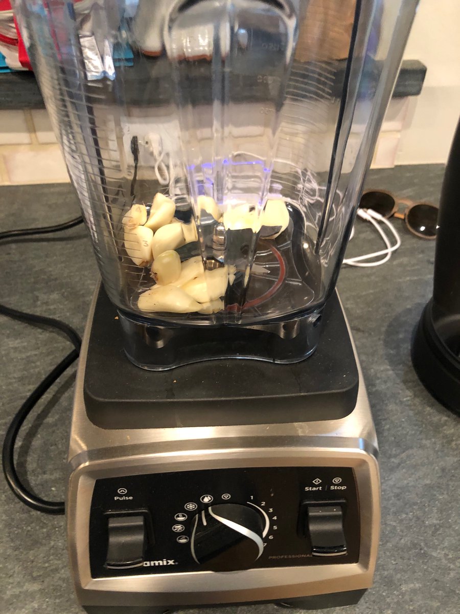 Peel the garlic, and add it to a processor with the peppers, salt, pepper, honey and 4 cups of the water from the bowl the peppers were soaking in
