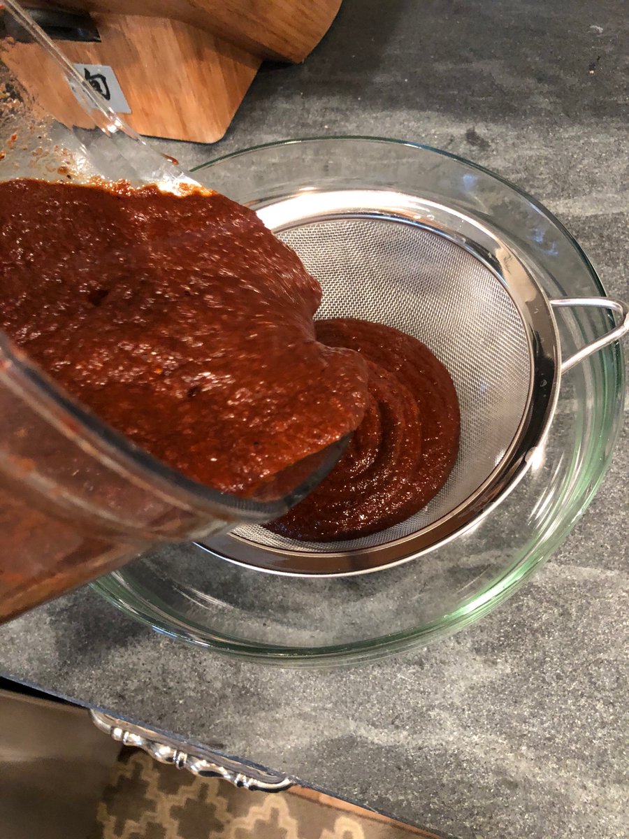 Purée the peppers and strain the mixture.