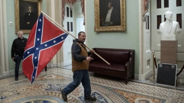 thehill's tweet photo. FBI seeks assistance identifying Capitol rioter who carried Confederate flag https://t.co/hw8UXXNKaV https://t.co/vtmiTSlIJj