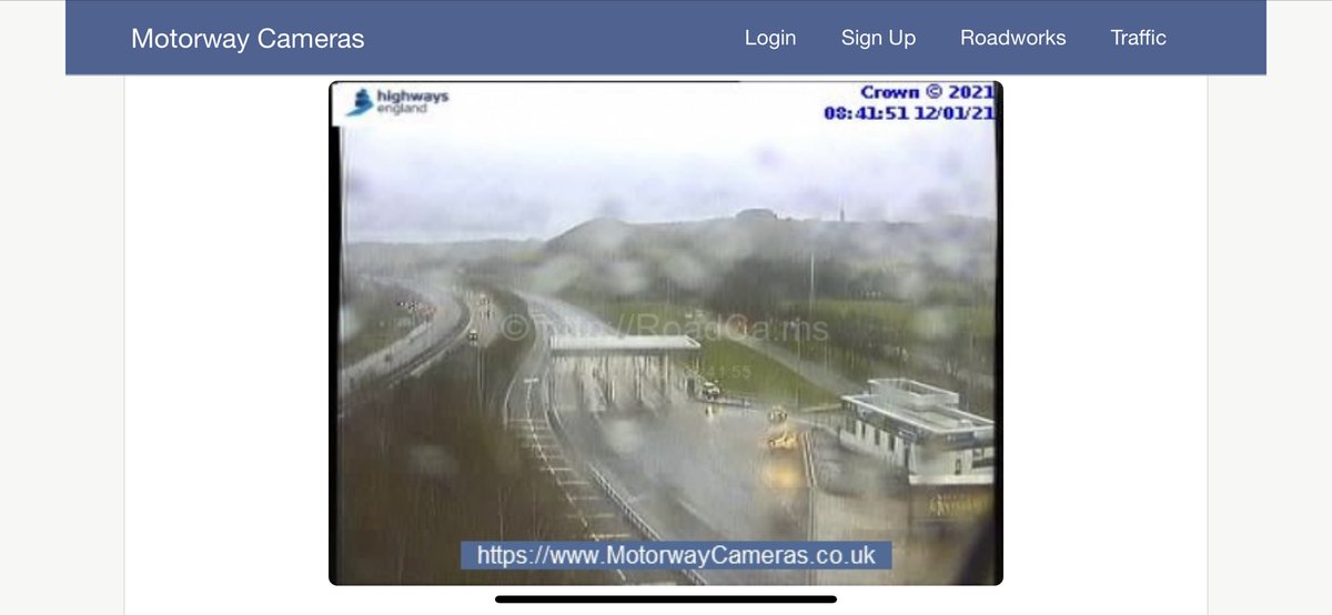 ITVJoel's tweet photo. I’m not sure what the freight entrance to Eurotunnel usually looks like at 08:41 on a Tuesday morning but the live camera shot is pretty deserted. Neither Eurotunnel nor Port of Dover publishes daily traffic numbers but we do know volumes remain significantly lower than normal. https://t.co/8fFag5YDZK