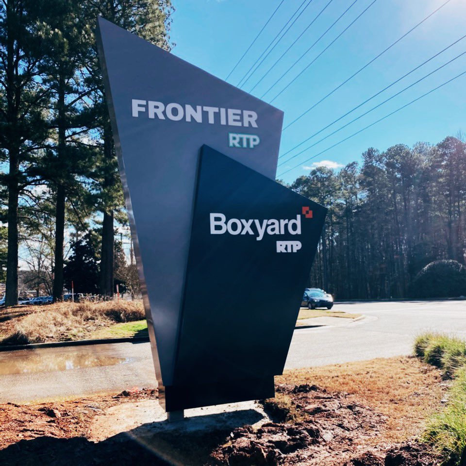 BoxyardRTP's tweet photo. 🦺 Update: Monument signs are finally IN and can be viewed on NC-54! For those who are wondering, #BoxyardRTP is conveniently located in the @FrontierRTP Innovation District - home to startups &amp; ideas alike. With Boxyard, we’re connecting #smallbiz to @TheRTP &amp; beyond.💡 https://t.co/mm7foZJEOU