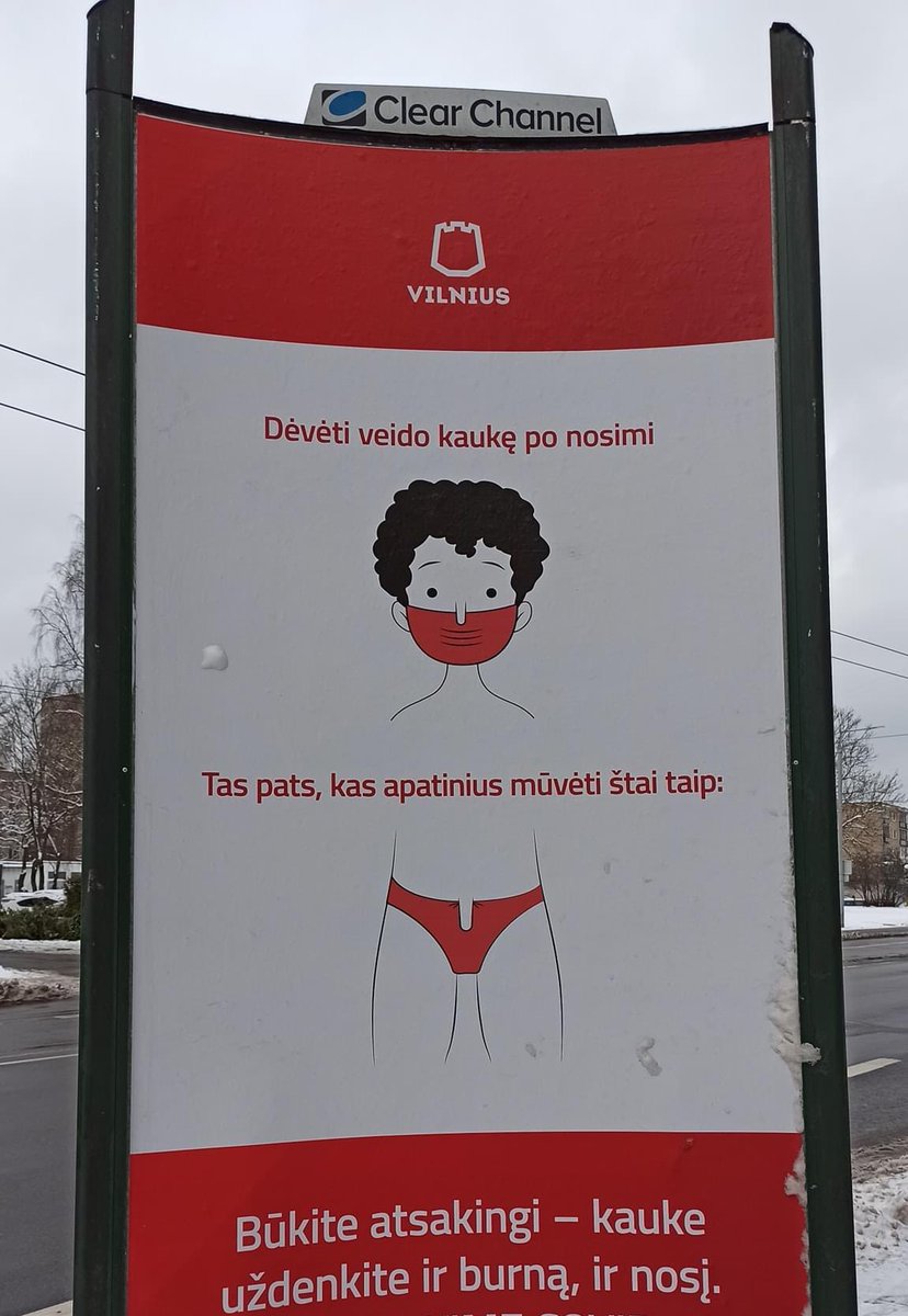 A cartoonish poster outside at the street. On the poster is this person in the mask covering only mouth and nose is out. And also body shown with underpants covering only under the wiener (so wiener is out). 
And poster says “to wear mask like this is same as wear underpants like that. Be responsible, cover all”