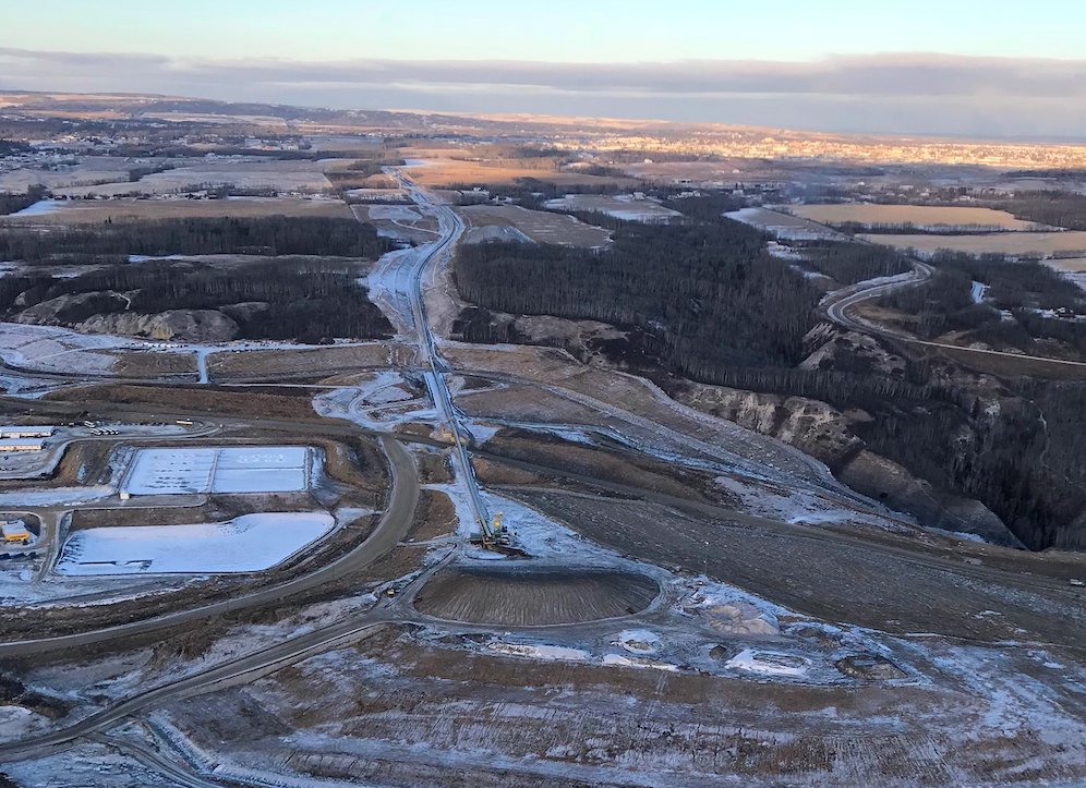 ..From a source in the Peace Valley on December 12, 2020, an aerial photo: "Of note is the stockpile at the end of the conveyor belt. All landscaped. Not much activity in the excavation area either. Must be prepping for a shutdown or why landscape?"  @sarahcox_bc  #SiteC  #bcpoli