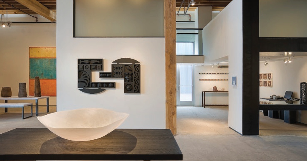 This Railyard space, occupied by Evoke Gallery, preserved the shell of the former Sears-Hansen Building while allowing the design to interact as a showcase for art.  The building won the State of New Mexico Heritage Preservation Award for urban design within a historic context.