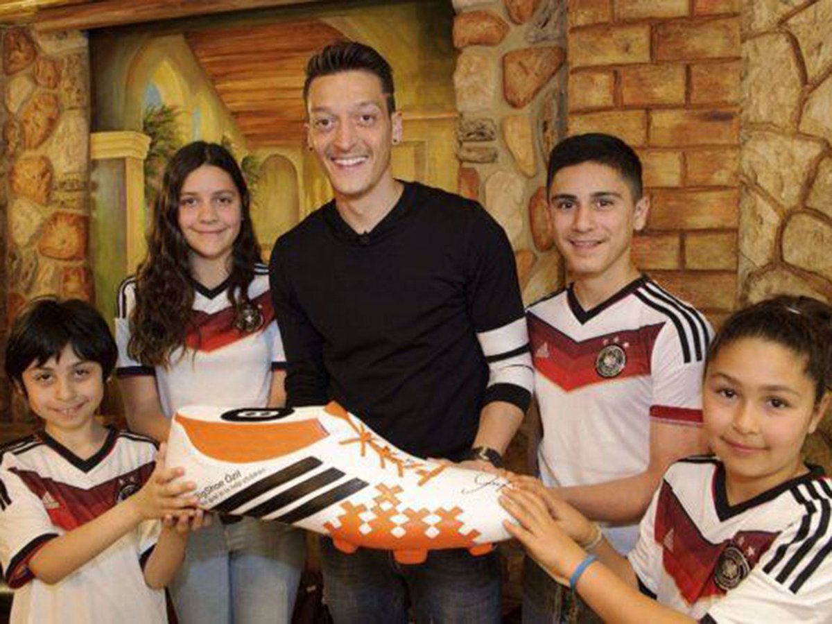 After the game UEFA President Michel Platini asked Özil for his shirt."I don't take the shirt from many players, but I'd love to have yours. It would be an honour."Özil donated his World Cup victory bonus to pay 23 Brazilian children's life changing surgerys.