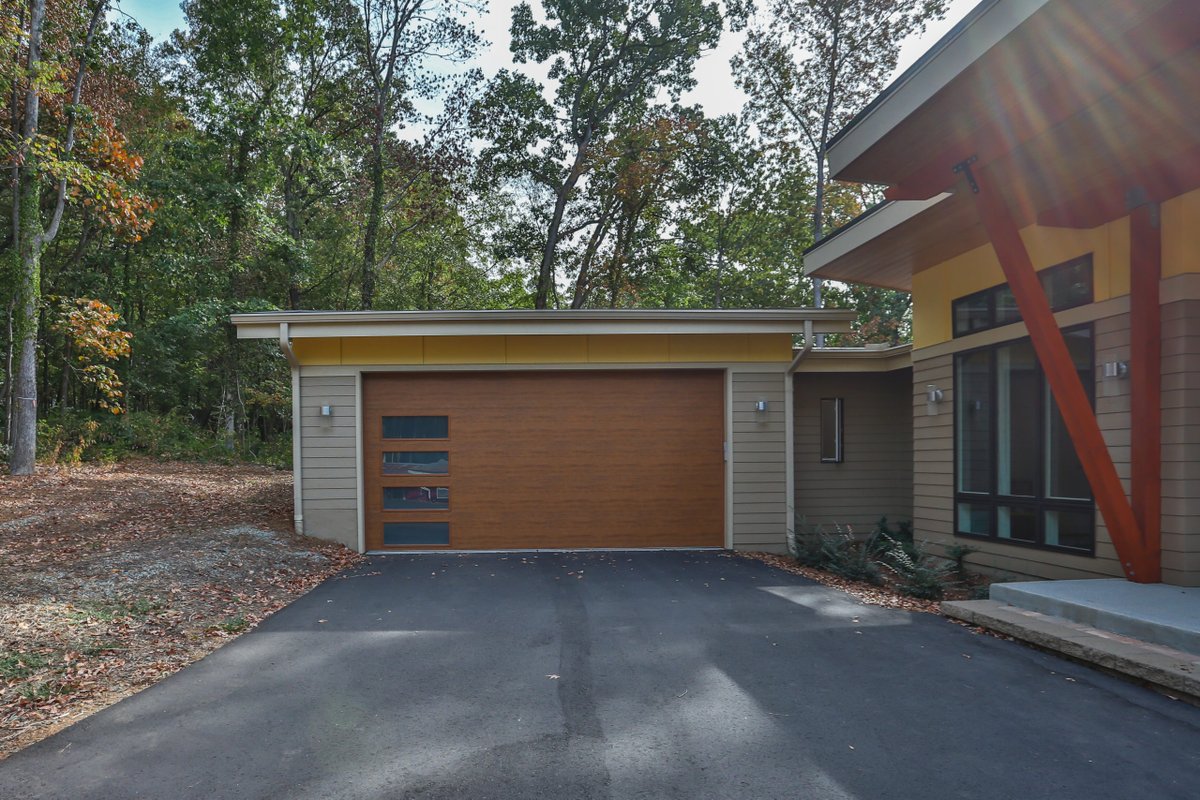 Amazing what a garage door can do for the design of a home! It's probably the last thing you think about when deciding to build a custom home, but it's an important decision! Which of these garage door designs is your favorite? buildboldnc.com