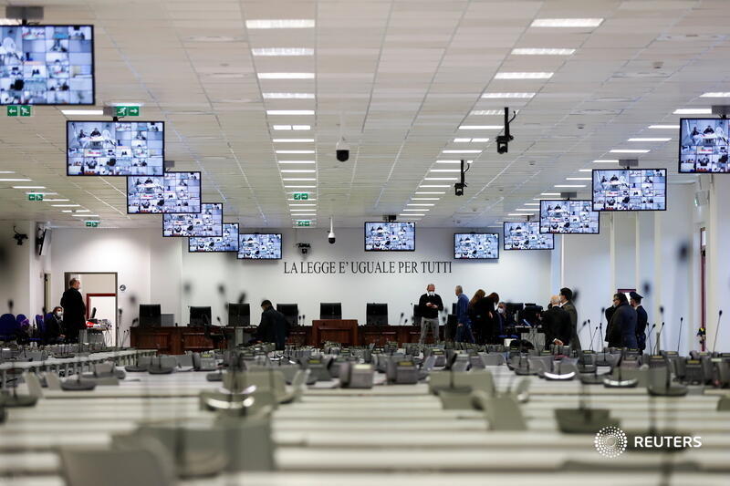 The trial is being held in a converted call-center in the Calabrian city of Lamezia Terme, with defendants placed in metal cages and rows of desks set up for the hundreds of lawyers, prosecutors, journalists and spectators expected to attend