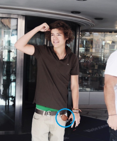 Holding a glasses case in his pocket. Guess who wears glasses.