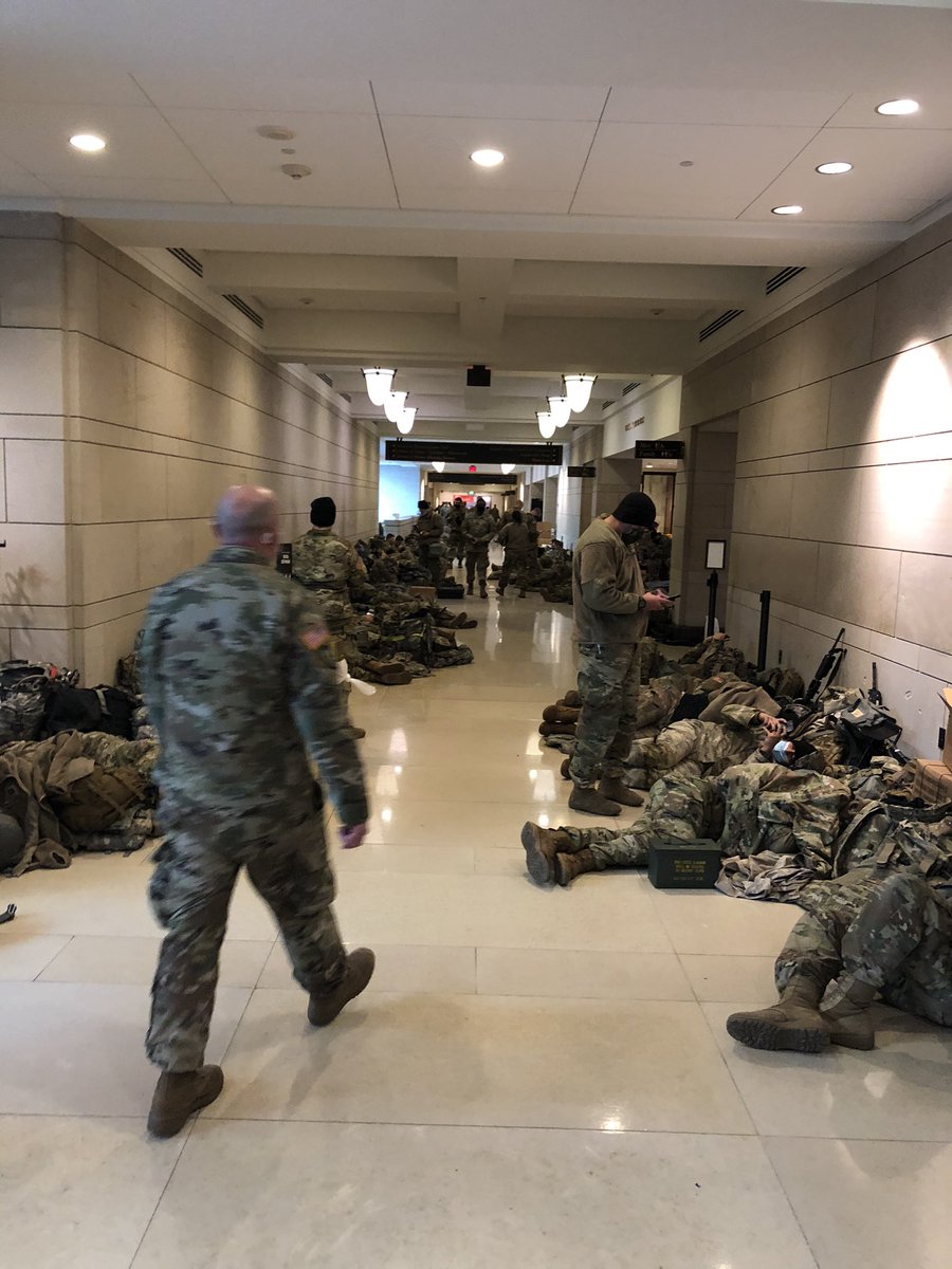 elwasson's tweet photo. The US Capitol is now a military base. Massive show of force outside. National Guard is armed with rifles and spread just few feet apart along perimeter as House prepares to impeach the president https://t.co/cPspvZMBUF