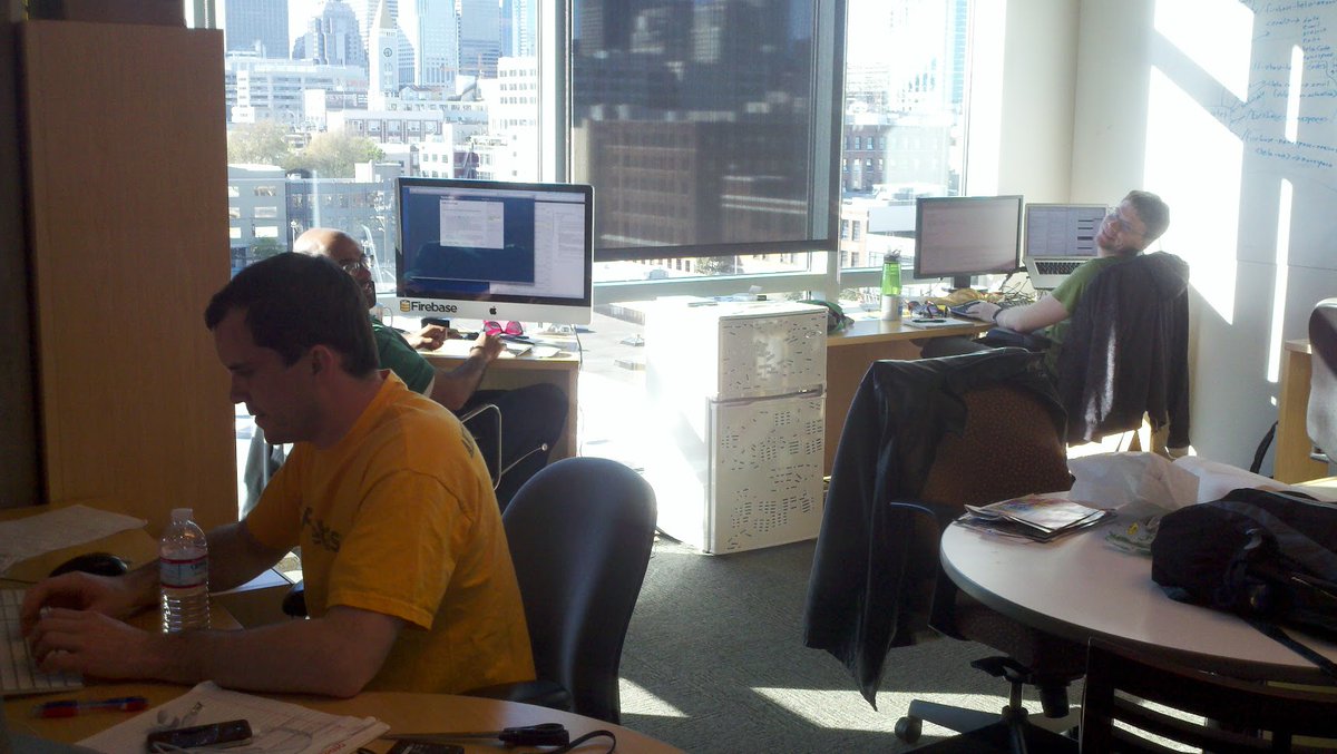 Then everything started working. They got into Y Combinator in the summer of 2011, providing enough money to pay themselves a salary and hire a couple of employees. Here's Andrew (left) with two early employees in April 2012.