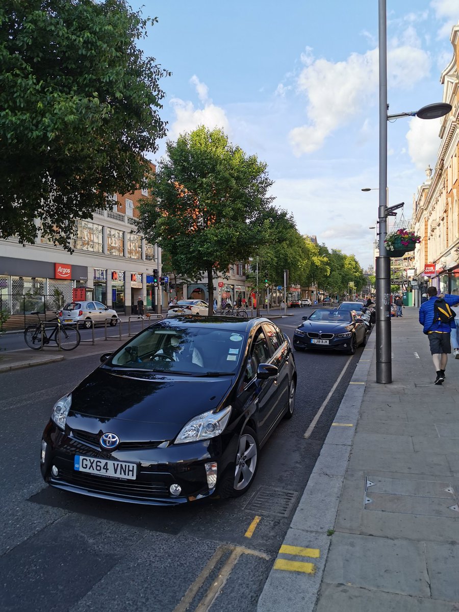 A few days later on 27 May  @djjmilner asks  @RBKC  @RBKC_cycling  @cllrKTS  @jthalassites"Can we temporarily turn this lane of parked cars into a protected cycle path on KSH?It would get more people to work safely, help local businesses."
