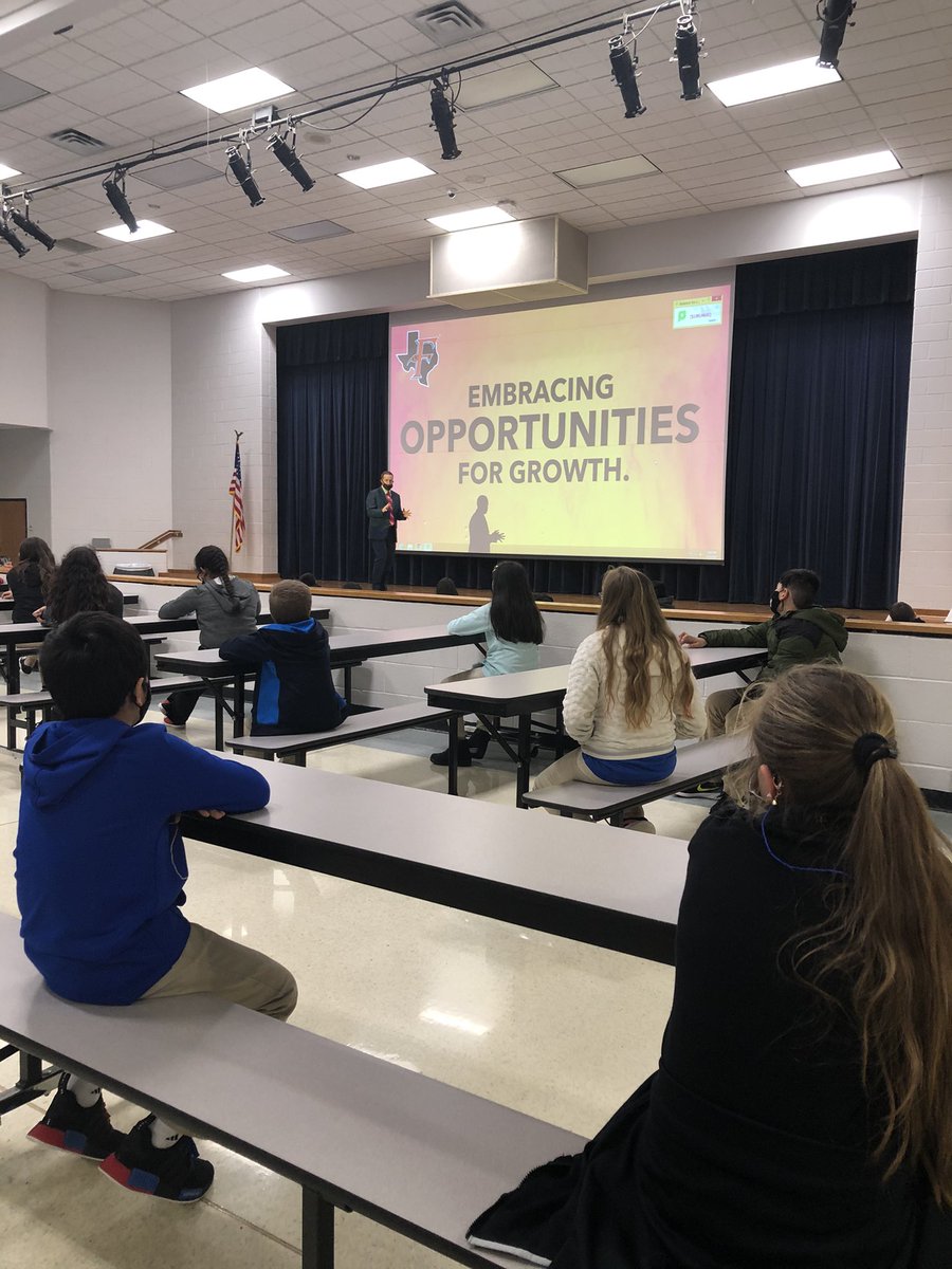 JaneDvorak's tweet photo. @ferrisisdjh Ferris JH 5th grade orientation Principal Lowery explaining to students, Embracing Opportunities for Growth. @cllowery https://t.co/xS3UDvZ20u