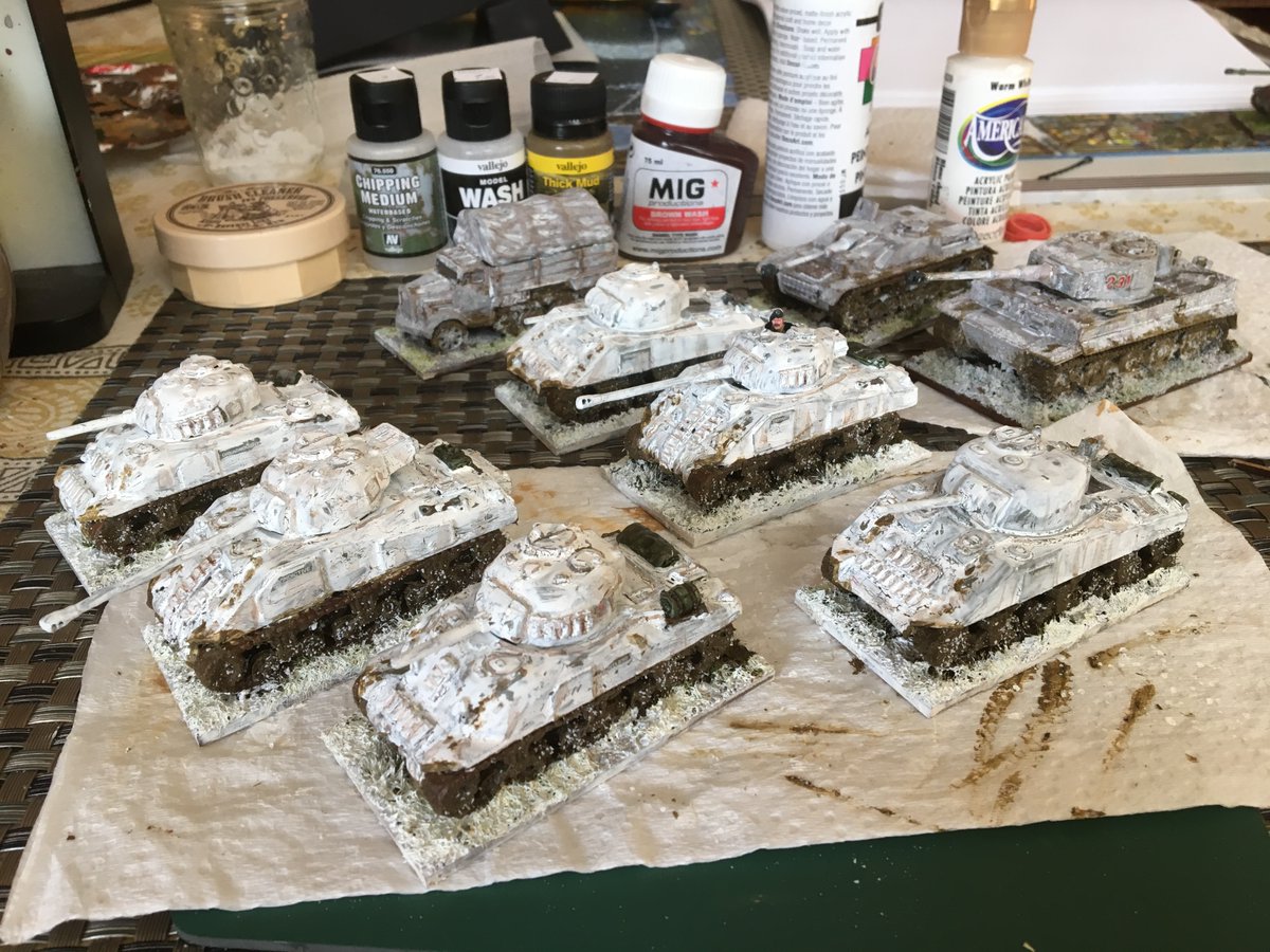 I had vehicles already painted for summer. I gave them all a white wash. I used Vallejo's white wash with extra white paint as needed.