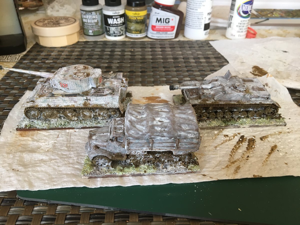 I had vehicles already painted for summer. I gave them all a white wash. I used Vallejo's white wash with extra white paint as needed.