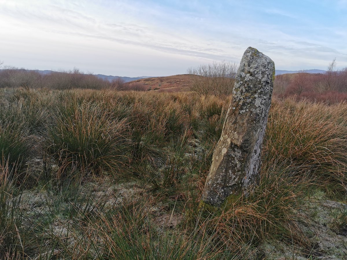 Walking on down the track (past a lot of cows!!) the next site is a standing stone by Creag Loisgte ('Burned Crag'). Canmore holds that it is prehistoric, possibly a boundary marker for the chapel's territory. A few paces down the track Eilean Aoidhe emerges into view...