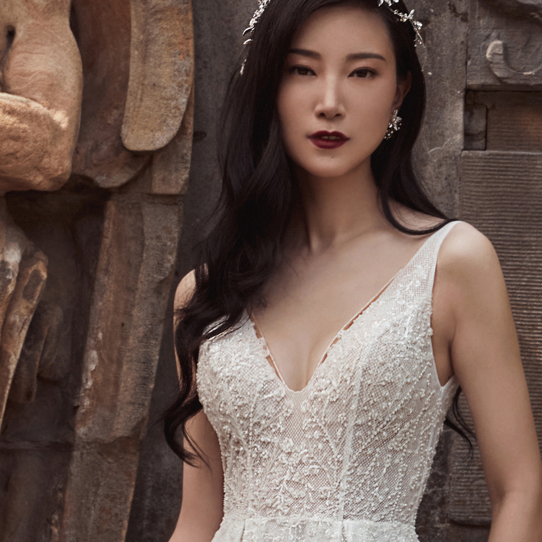 The epitome of ease and elegance, Alice~121110 is your #classic #weddingdress with a flirty twist. Featuring a modest v-neckline, intricately detailed beaded lace, a naughty high slit &amp; pockets, she can be paired with the #matchingveil to provide the finishing touch.