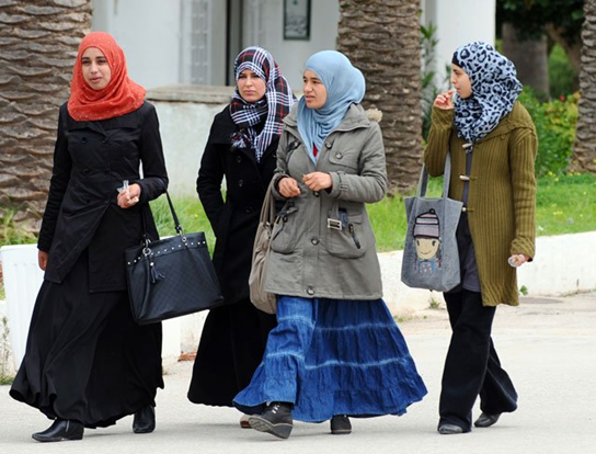Women:The sefseri is pretty but most women who choose to veil in Tunisia nowadays don't wear them anymore (only some older women still do), instead they wear "modern-style" hijabs.In KSA women mostly wear a local black (not always) dress called "Abaya".